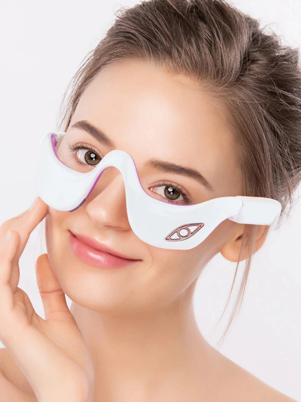 A women wearing the LED Electric Eye Massager.